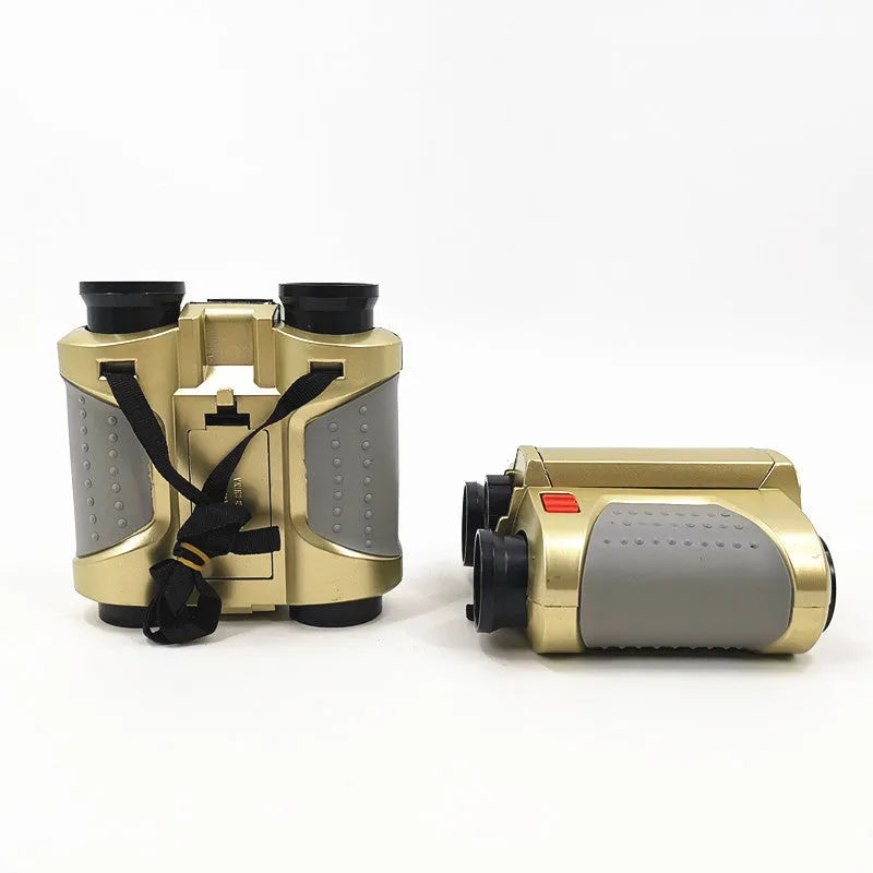 Children's telescope with light binoculars on a green field during sunset, showing the built-in light feature
