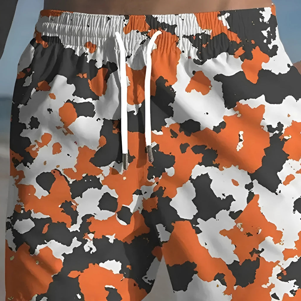 Men's polyester beach shorts with elastic waistband in various printed colours
