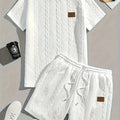 Men's black sports two-piece set with ribbed short sleeve top and matching shorts