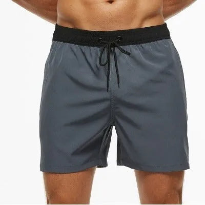 Men's blue stitching waist athletic shorts with a drawstring and zippered side pocket.