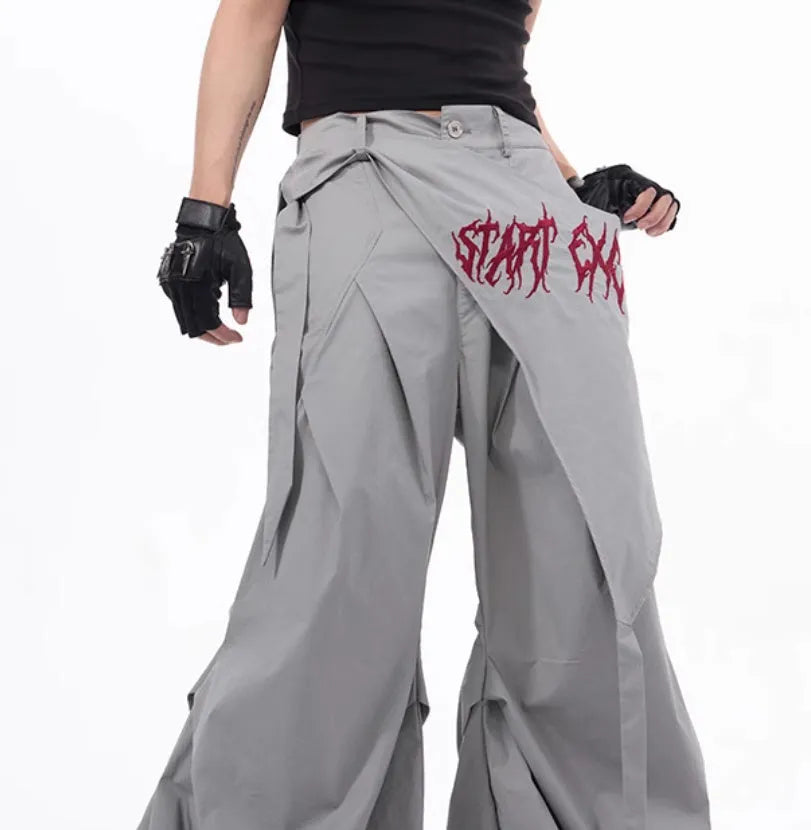 Boy wearing black wide-leg Korean style summer trousers with an elasticated waistband.