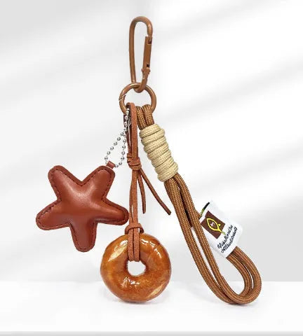 Handmade soda bread style handbag pendant with brown carrying strap