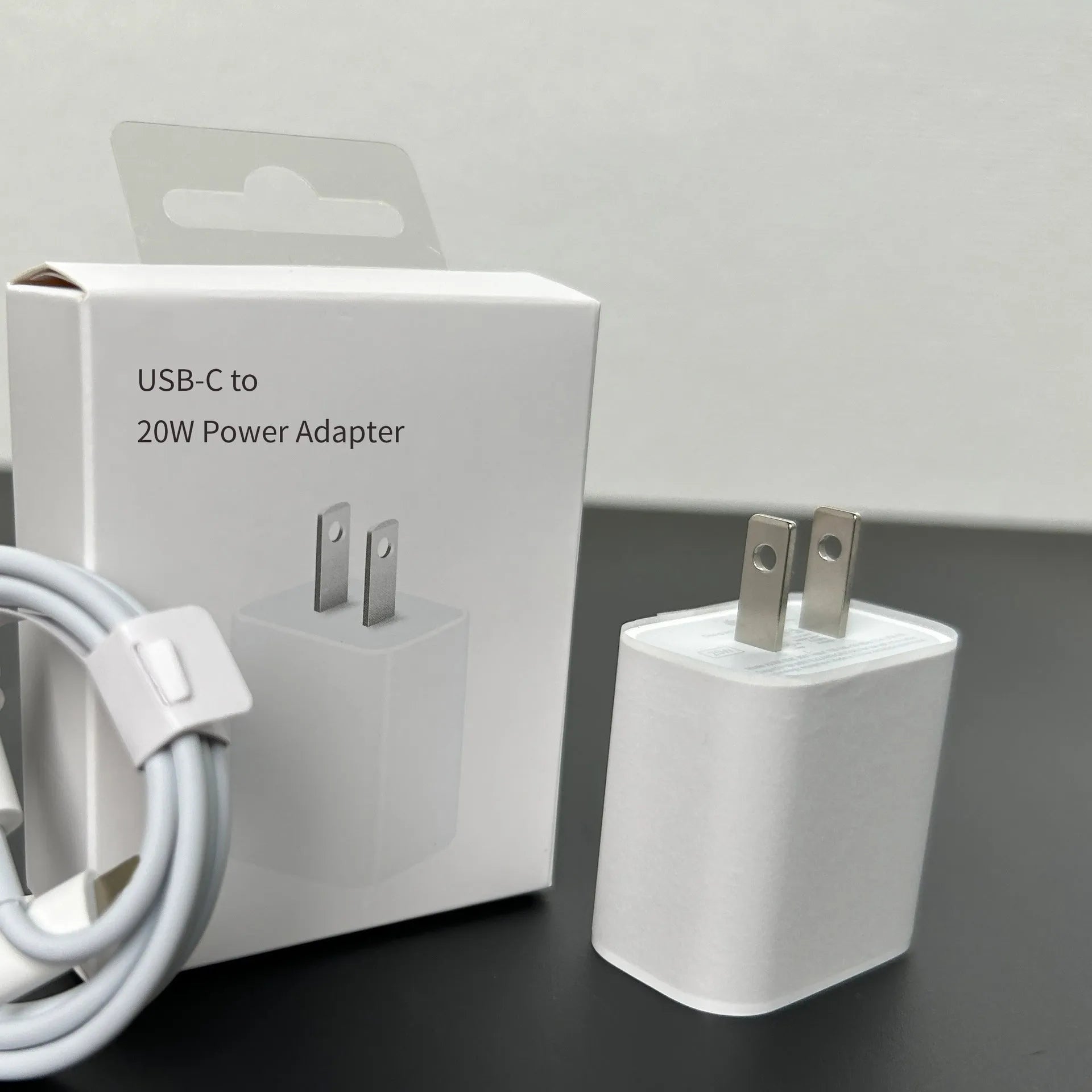 White 20W mobile PD charger with Type-C interface showing international plug compatibility