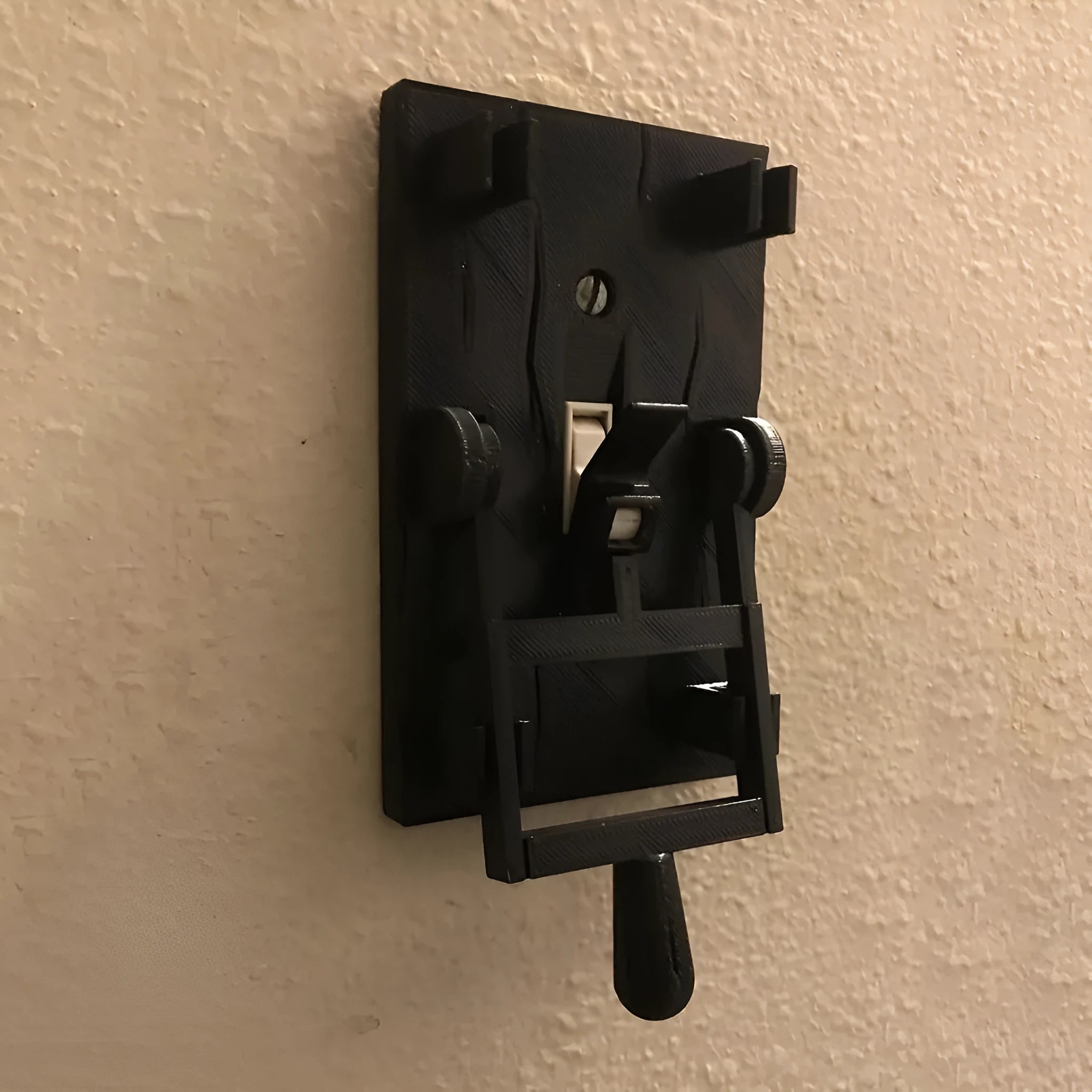 A retro-styled single-gang mechanical light switch plate for American standard exposed installation.