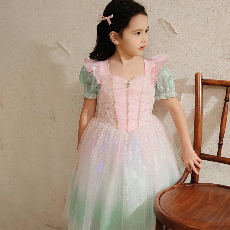 Little girl wearing a puff sleeve mermaid princess dress in cotton fabric, solid colour style, suitable for party or wedding