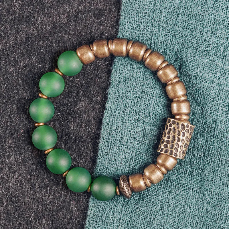 Retro ethnic style couples bracelet with natural green agate beads shown on a wrist.