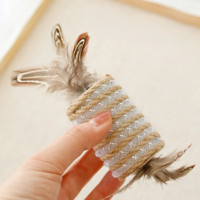 Beige cat toy made of hemp rope with feathers and an integrated roller for scratching and play