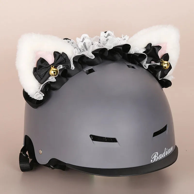 Soft plush cartoon character cover on a motorcycle helmet, showing size M and decorative ear sections.