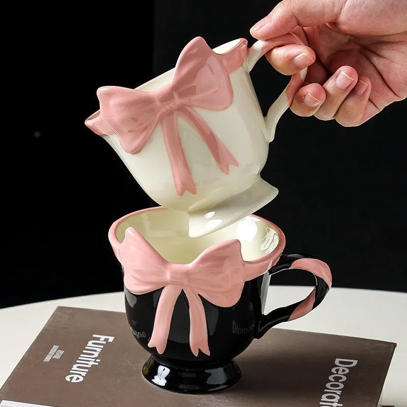 Ceramic mug with girl heart bow design in black pink or white powder colours, 301-400ml capacity