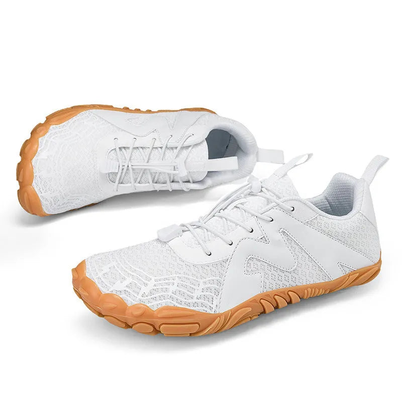 Unisex flyknit-lined climbing shoes with rubber sole in multiple colour options on a climbing hold.
