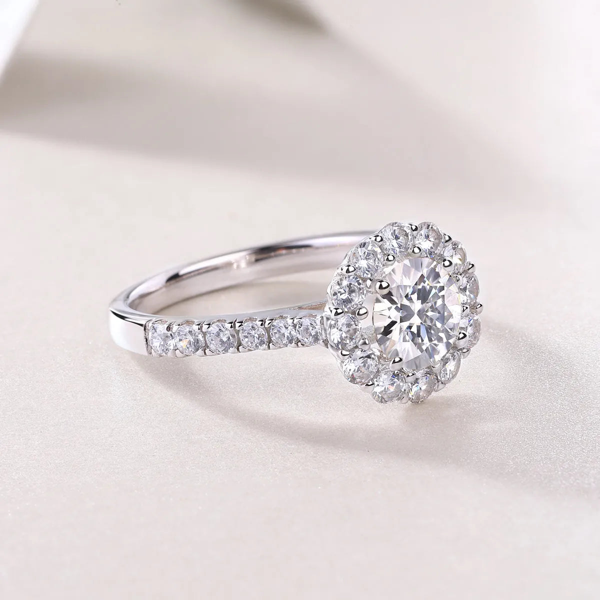1-carat moissanite wedding ring set in S925 silver with platinum plating on white background