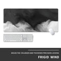 Large grey gaming mouse pad with geometric cool-style design on desk with keyboard and mouse.