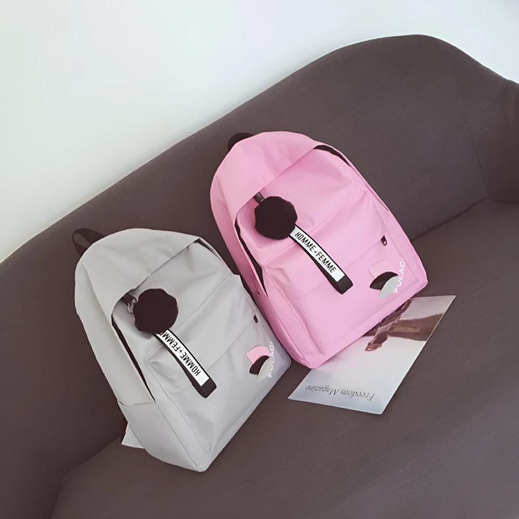 Canvas college schoolbag with leaves pattern showing anti-theft features and adjustable shoulder straps