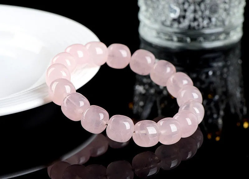 Pink crystal barrel bead bracelet with geometric design, 11-12mm beads, unisex accessory