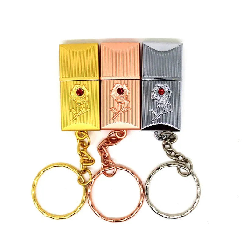 Metal and crystal USB flash drive in gold finish with decorative crystal front on white background