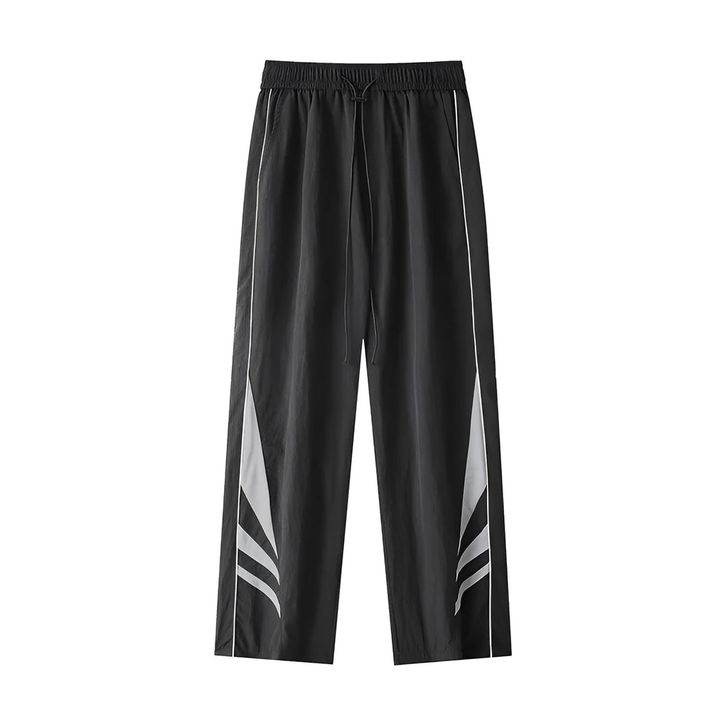 Men's black plus-size straight-leg casual trousers on a grey background, showing button detail and loose fit.