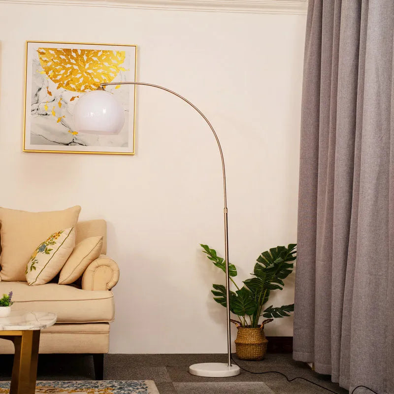 Modern minimalist fishing floor lamp with white acrylic shade on marble base with polished stainless steel pole
