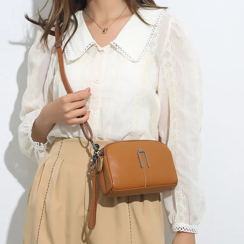 Genuine leather women's square shoulder bag in dark khaki colour, showing structured horizontal shape.