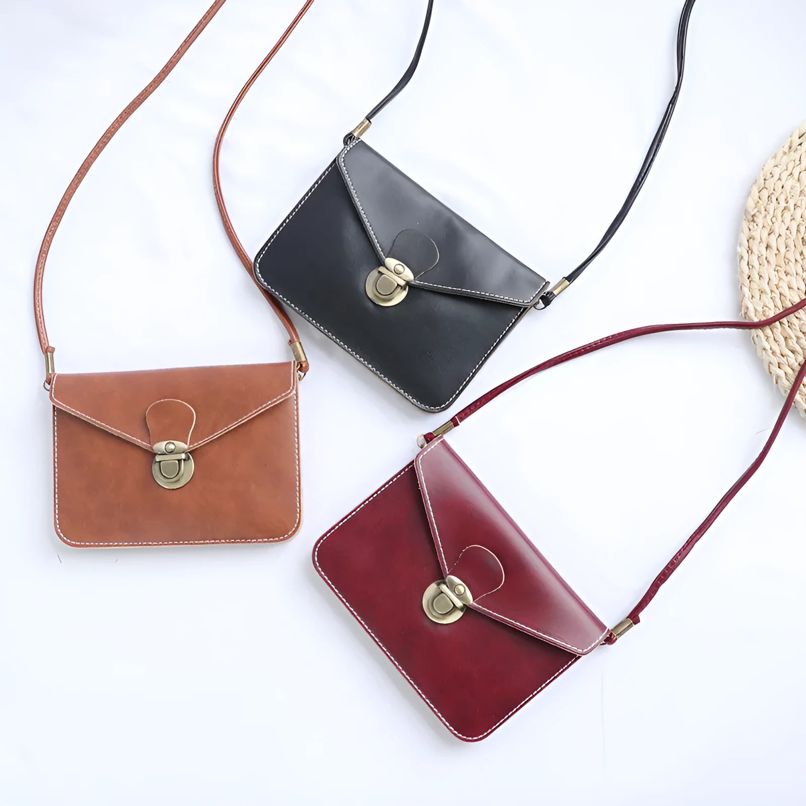 Retro soft surface crossbody messenger bag with flap closure in wine red colour showing internal phone pocket