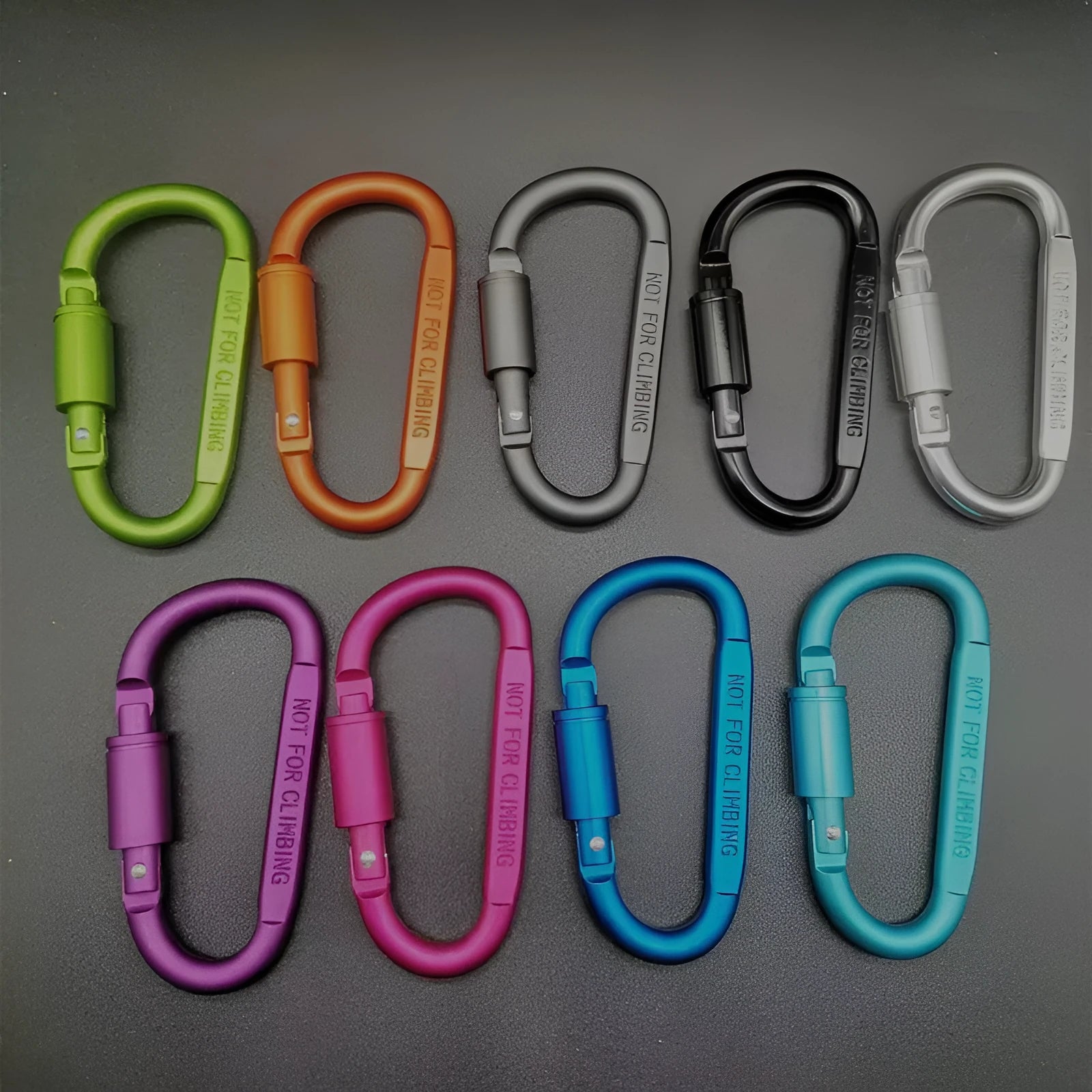 Aluminium D-shaped carabiner with lock in multiple colour options on a grey background.