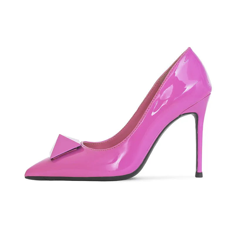 Pink women's patent leather stiletto high heels with a buckle and pointed toe.