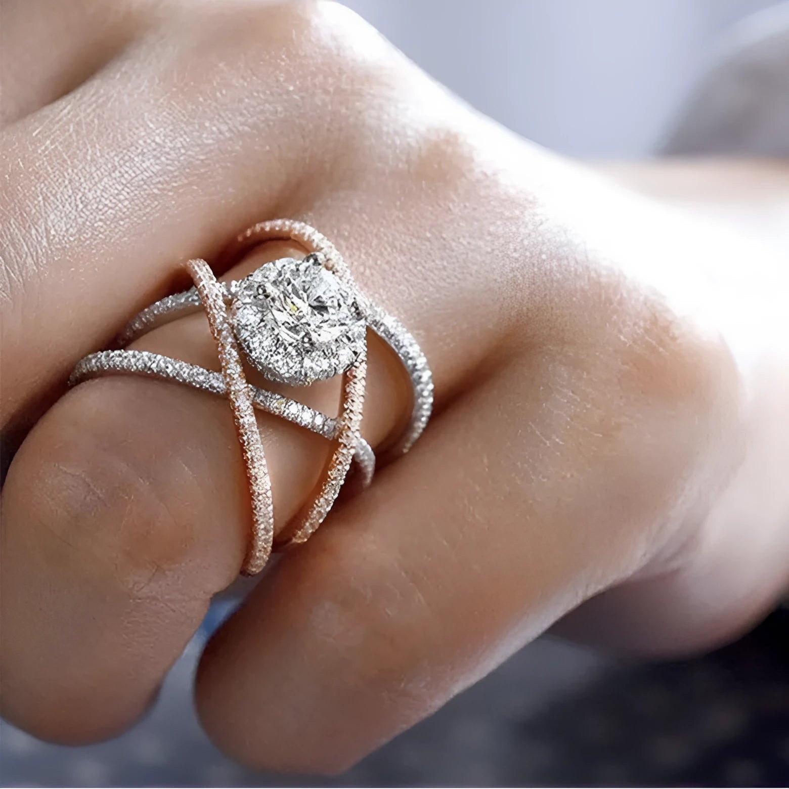 Women's geometric cross zircon engagement ring in copper with rose gold colour separation on display
