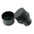 Hand-held black tyre oil sponge brush with lid on a white background.