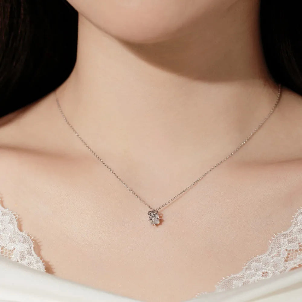 S925 sterling silver necklace and earring set with bear pendant in gold finish on display