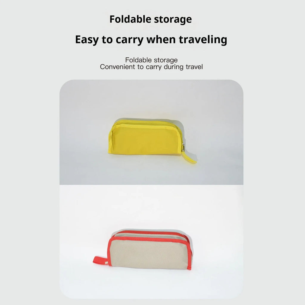 A foldable camp stool made from oxford cloth, shown in a khaki colour, folded into its compact pencil box shape.