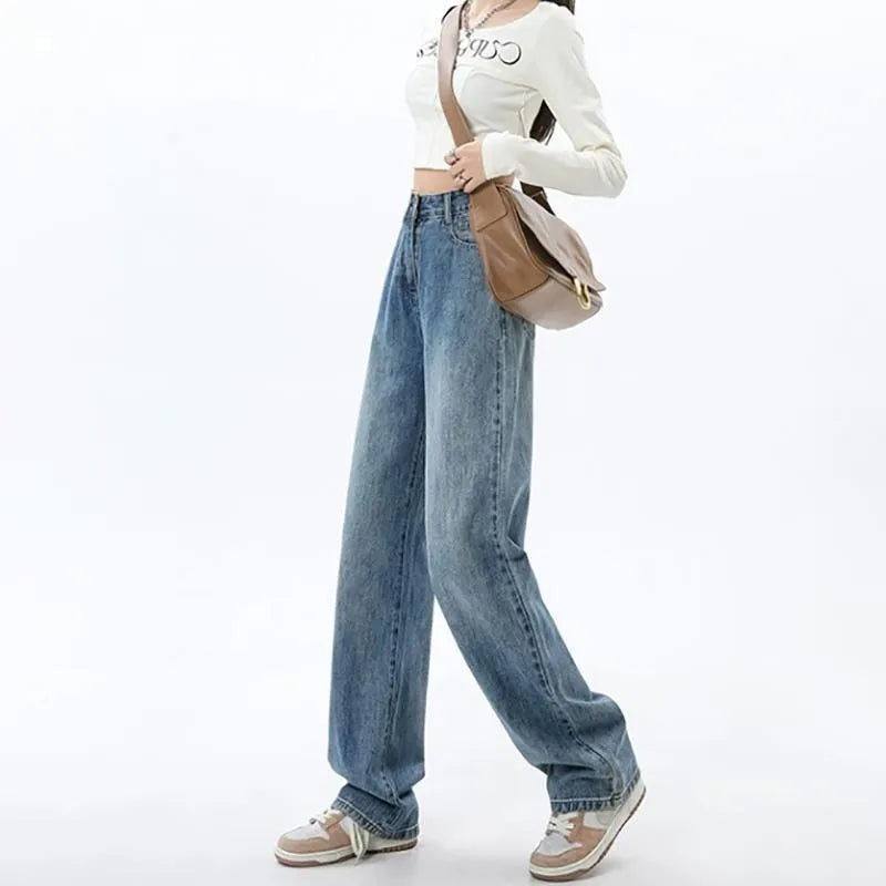 Woman wearing high-waisted retro blue wide leg jeans with a straight-leg cut.