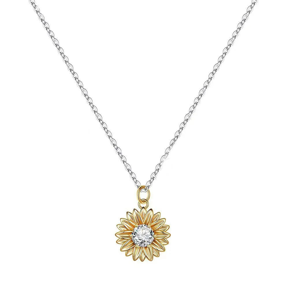 Geometric sunflower daisy pendant necklace on a silver cross chain, adjustable length.