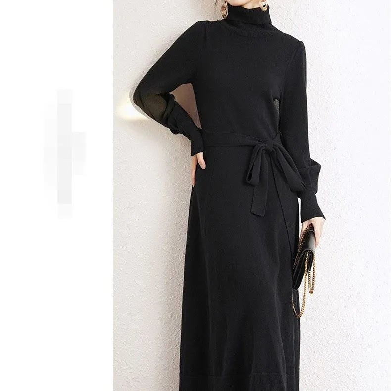 Women's rose red turtleneck knitted dress with long sleeves and a mid-length skirt.