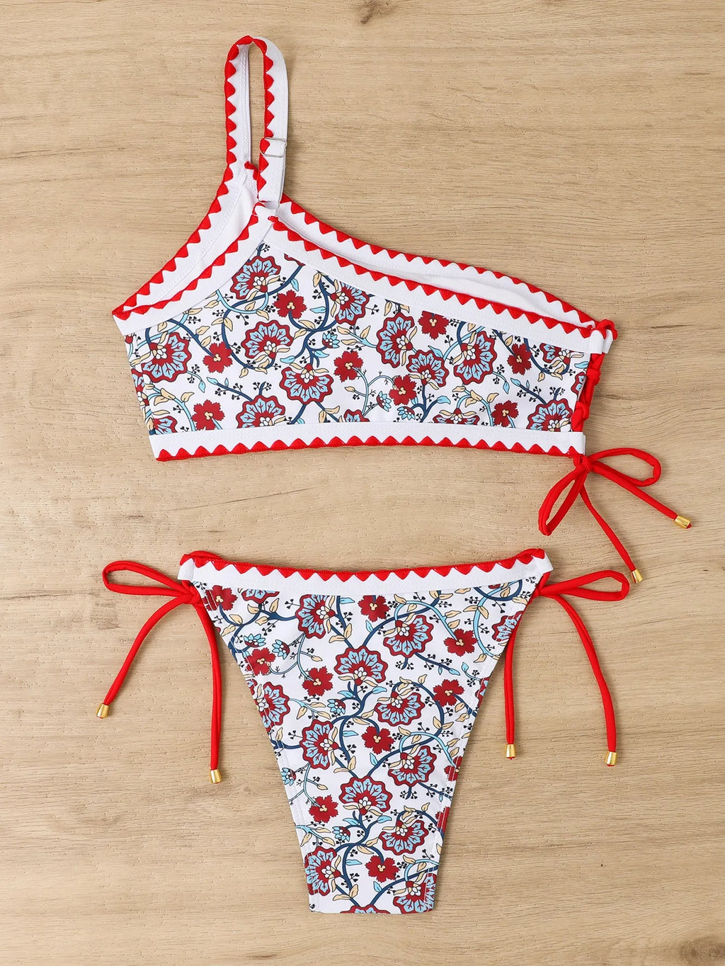 Women's blue one-shoulder bikini swimsuit with floral pattern
