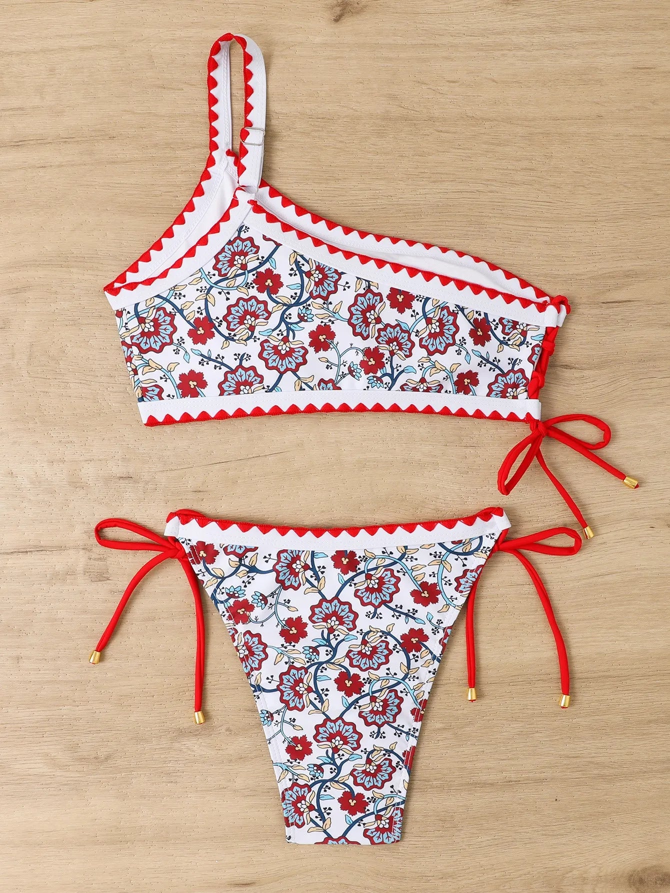 Women's blue one-shoulder bikini swimsuit with floral pattern