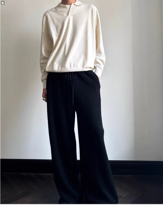 Pure wool polo sweater with lapel collar in loose fit, shown in navy blue colour.