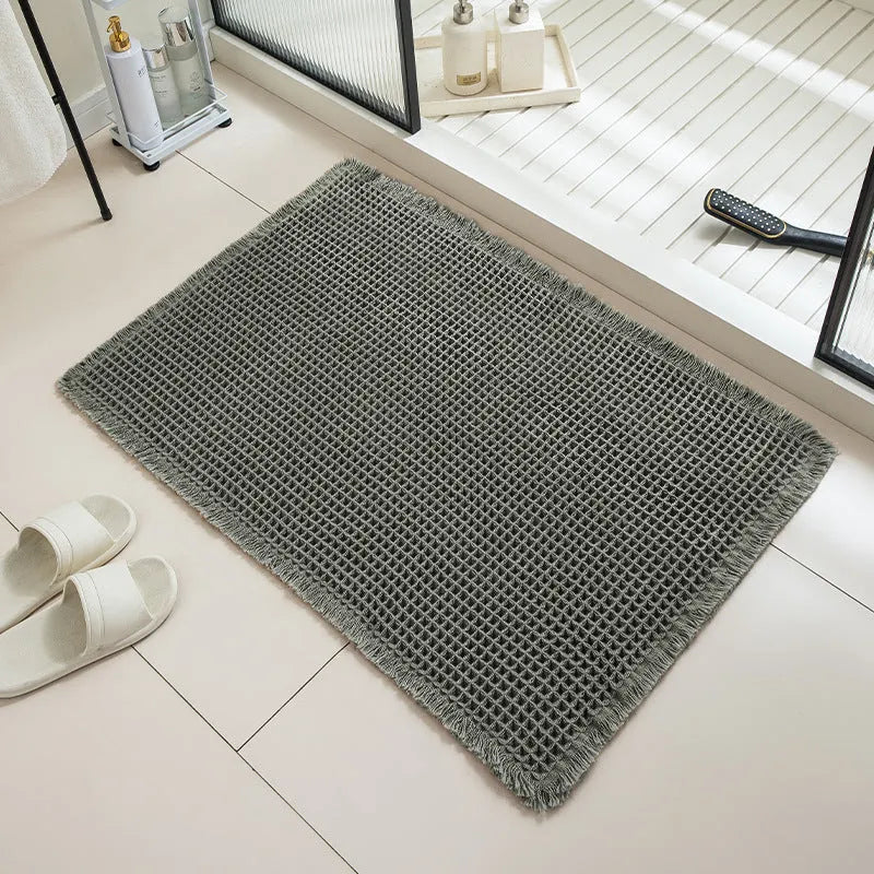 Checkered non-slip bathroom floor carpet in beige, available in multiple sizes from 43x61cm to 61x183cm