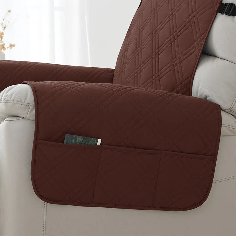 Quilted burgundy waterproof sofa cover stretched over a small single cushion.