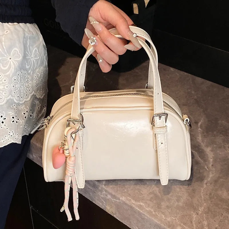 Korean-style women's shell shoulder bag in square shape with optional pendant attachment