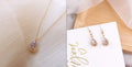 Crystal water drop pendant necklace on a woman, adjustable silver plated chain, clear drop shape pendant close up