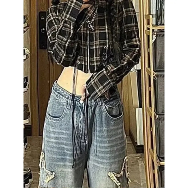 Blue high-waist wide-leg denim jeans with straight-leg fit on hanger
