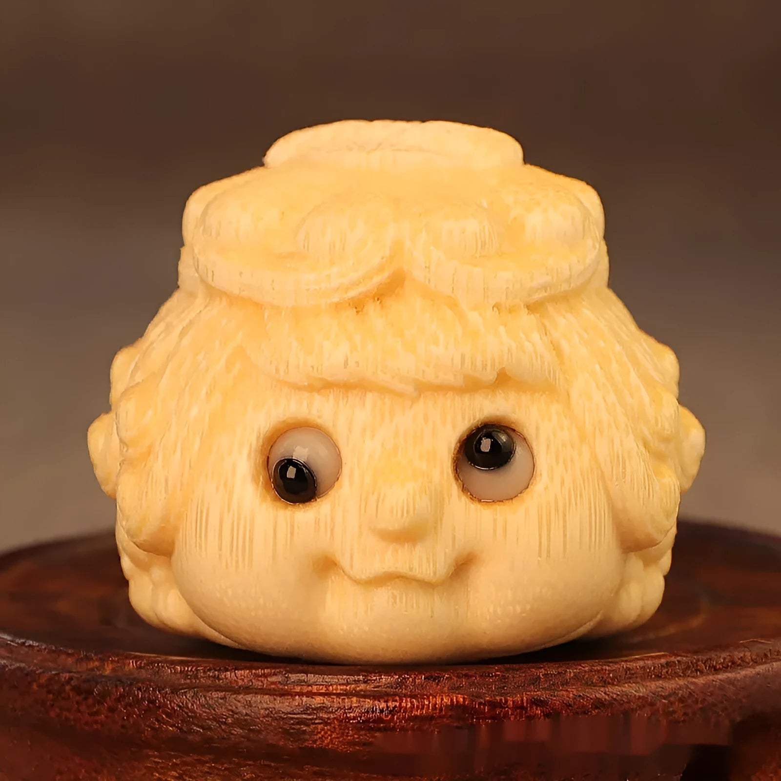 Solid bamboo carving of a cute golden toad Princess ornament for home display.