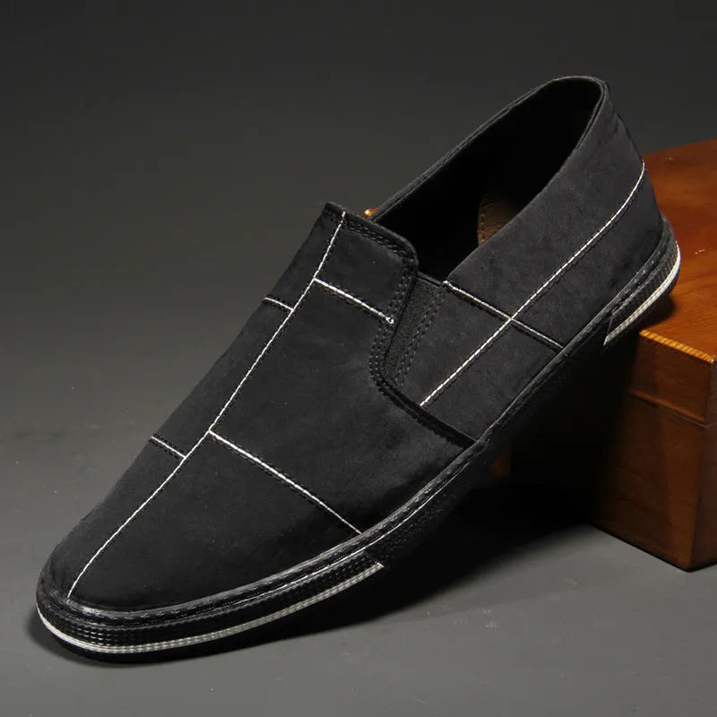 Men's low-top canvas slip-on shoes in khaki colour with a round toe and vulcanised rubber sole.