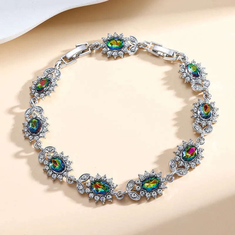 Simple women's alloy bracelet with a single row of inlaid zircon stones in a choice of nine gemstone colours.