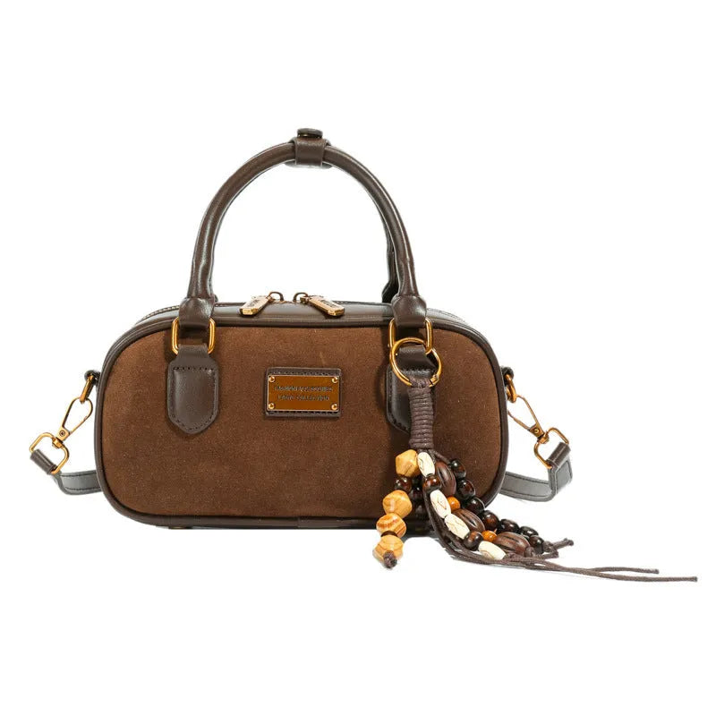 Niche PU one-shoulder messenger bag with stitching horizontal square shape and pendant