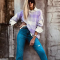 Lilac plaid print loose-fitting women's sweater with long sleeves and ribbed trim.