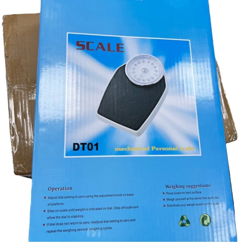 Black mechanical bathroom scale with analogue dial showing weight measurements