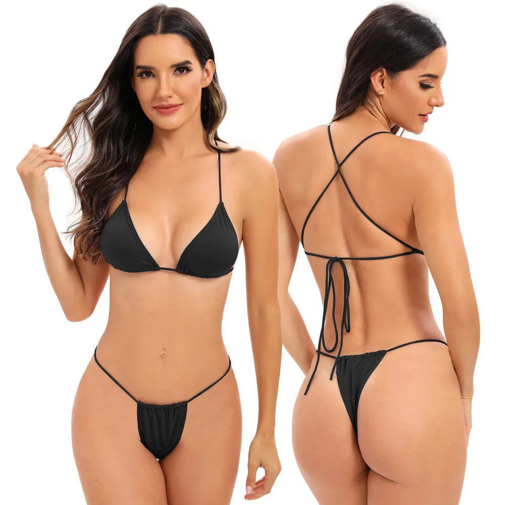 Women's candy coloured cross strap split swimsuit with multiple straps on a mannequin.