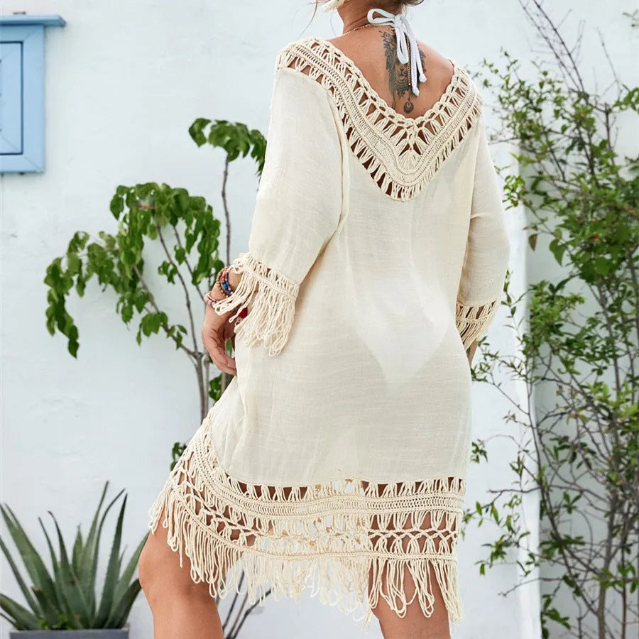 Apricot coloured crocheted patchwork dress with half sleeves and a mid-length hem.