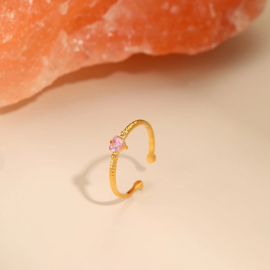 Heart-shaped open-ended ring with geometric design and inlaid zircon detail in stainless steel