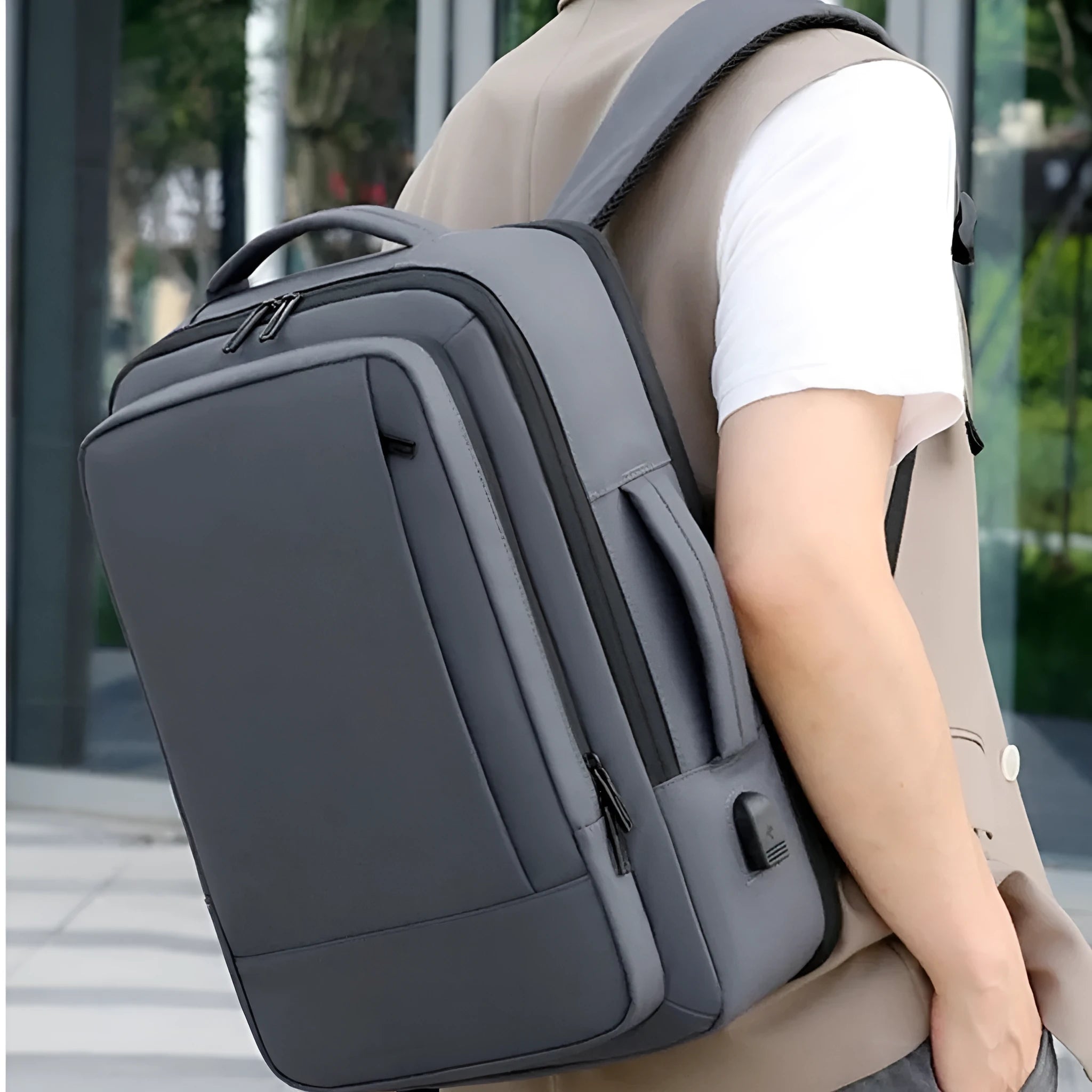 Men's large capacity waterproof backpack in black with curved shoulder straps and business styling
